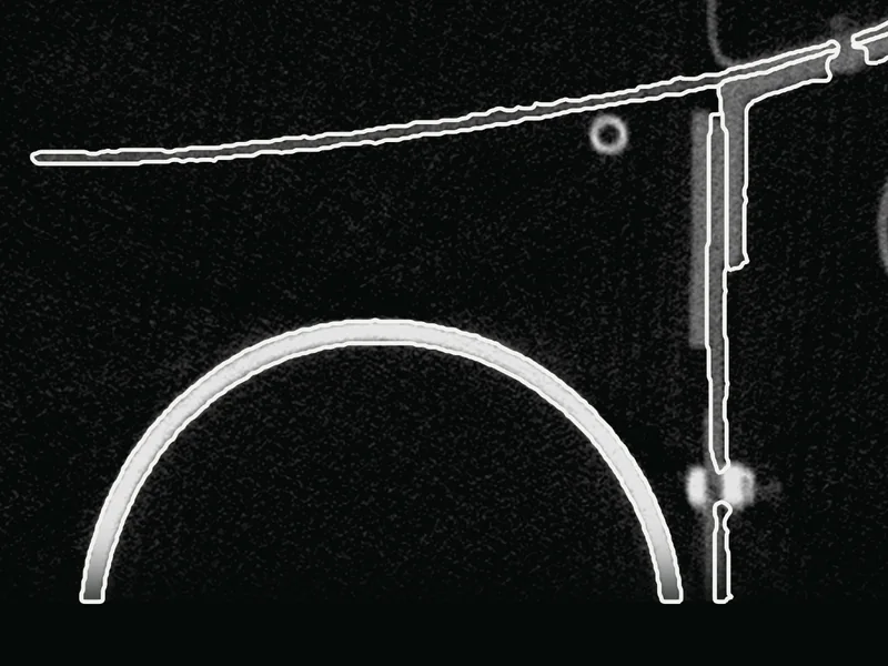 An axial slice of a real industrial CT scan: a bottle wall, a frame, a stringer and a beam, each outlined in white with its instance number.