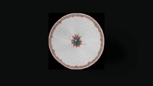 The slice with the authors' scripted pulp segmentation in long dashes beside the model's short-dashed proposal.